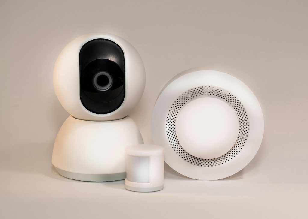 Different smart home devices including a camera, motion sensor and hub