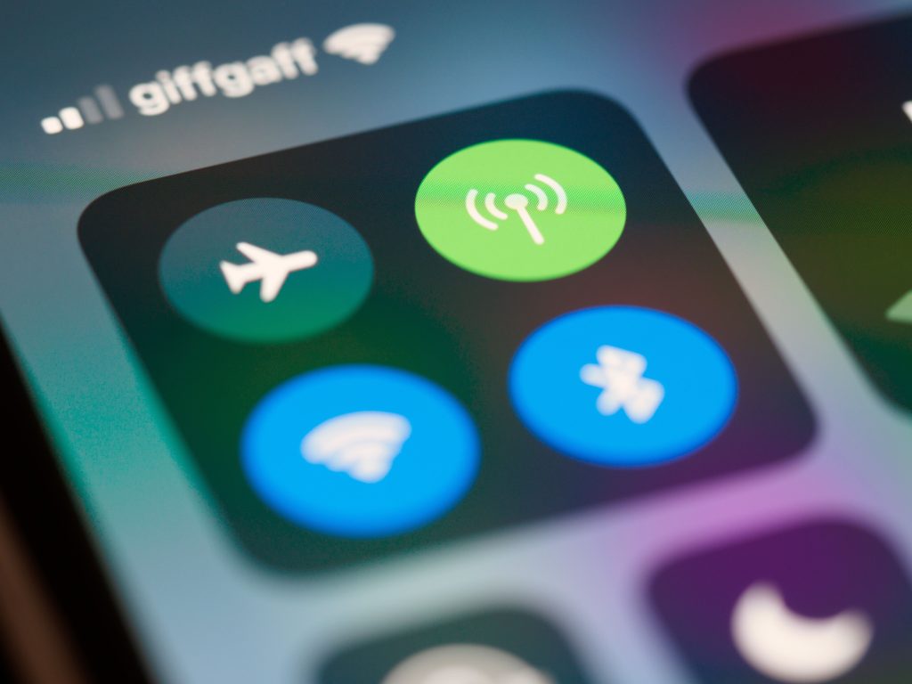 A smartphone screen showing wireless connectivity icons including WiFi and Bluetooth
