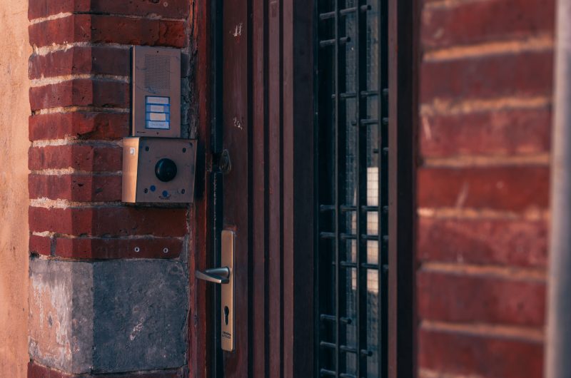 Are smart doorbells worth it — a video doorbell and intercom installed on a brick wall
