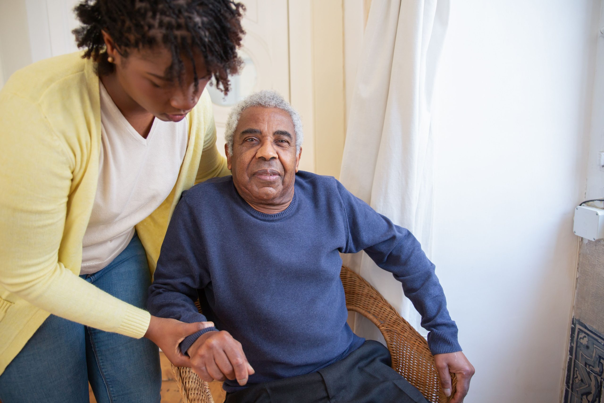 Elderly person using a smart speaker for home automation reminders