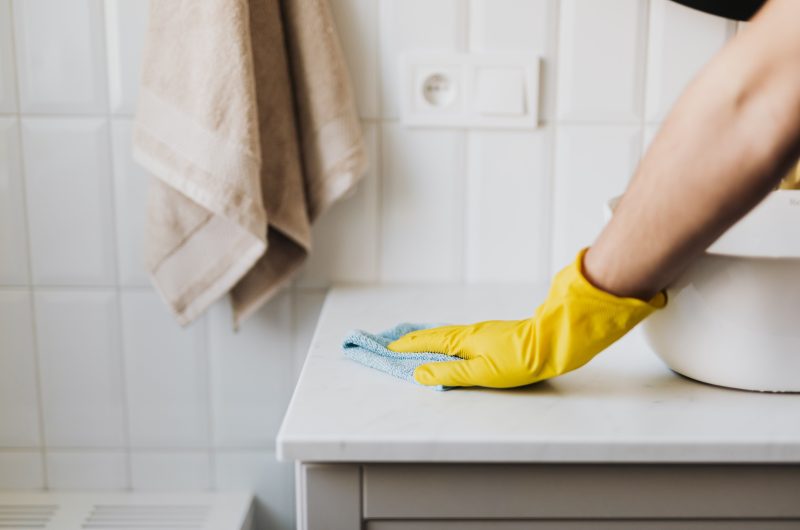 Smart home water leak detector placed under kitchen sink to prevent water damage